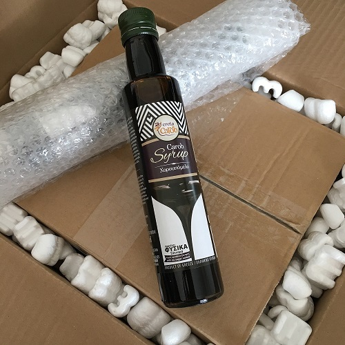 Organic carob syrup packed safely for international shipment
