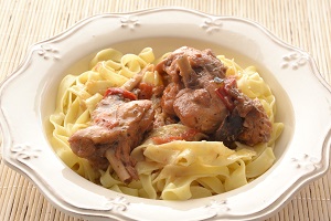 Rabbit meat with lemon sauce and Cretan pasta
